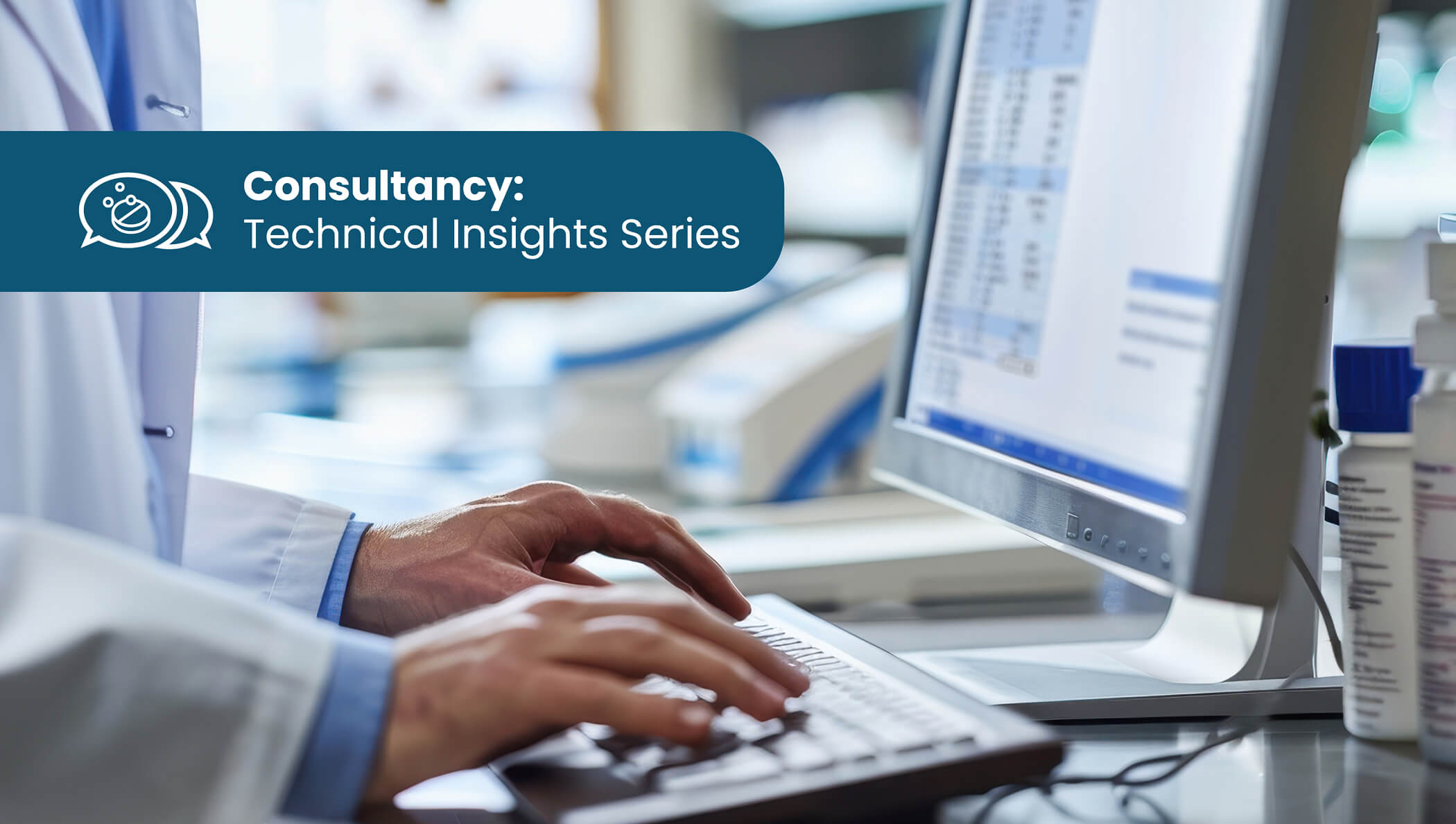 Lab technician typing on computer keyboard