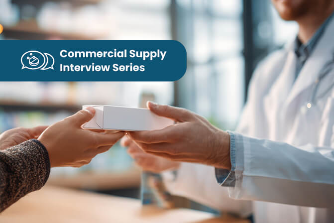 Pharmacist hands a medication box to a customer in a pharmacy setting