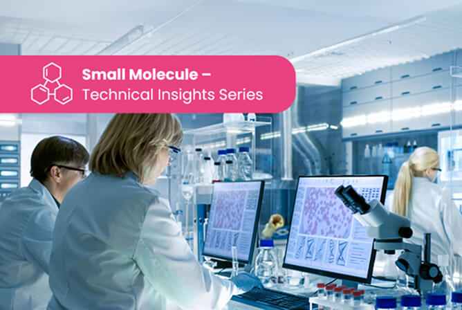 Scientists in a modern biomedical laboratory using microscopes and computer stations
